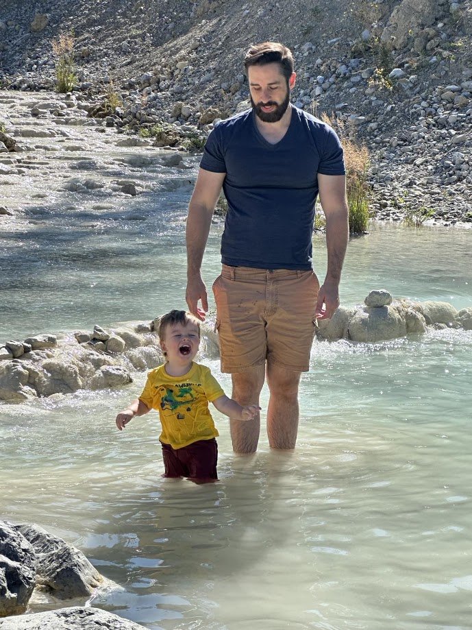 Cole Kander and his son at a creek