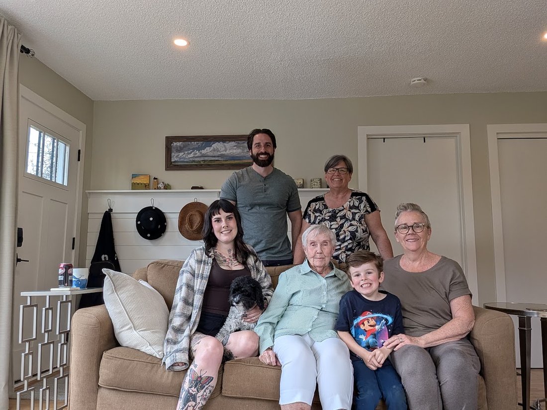 Four generations of the Kander family gathered in a parlour