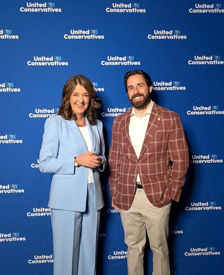 Cole Kander with Premier Danielle Smith